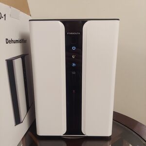 Pthraouta 3 Liter 75 Watt Compact Indoor Dehumidifier, Black / White, Like New i